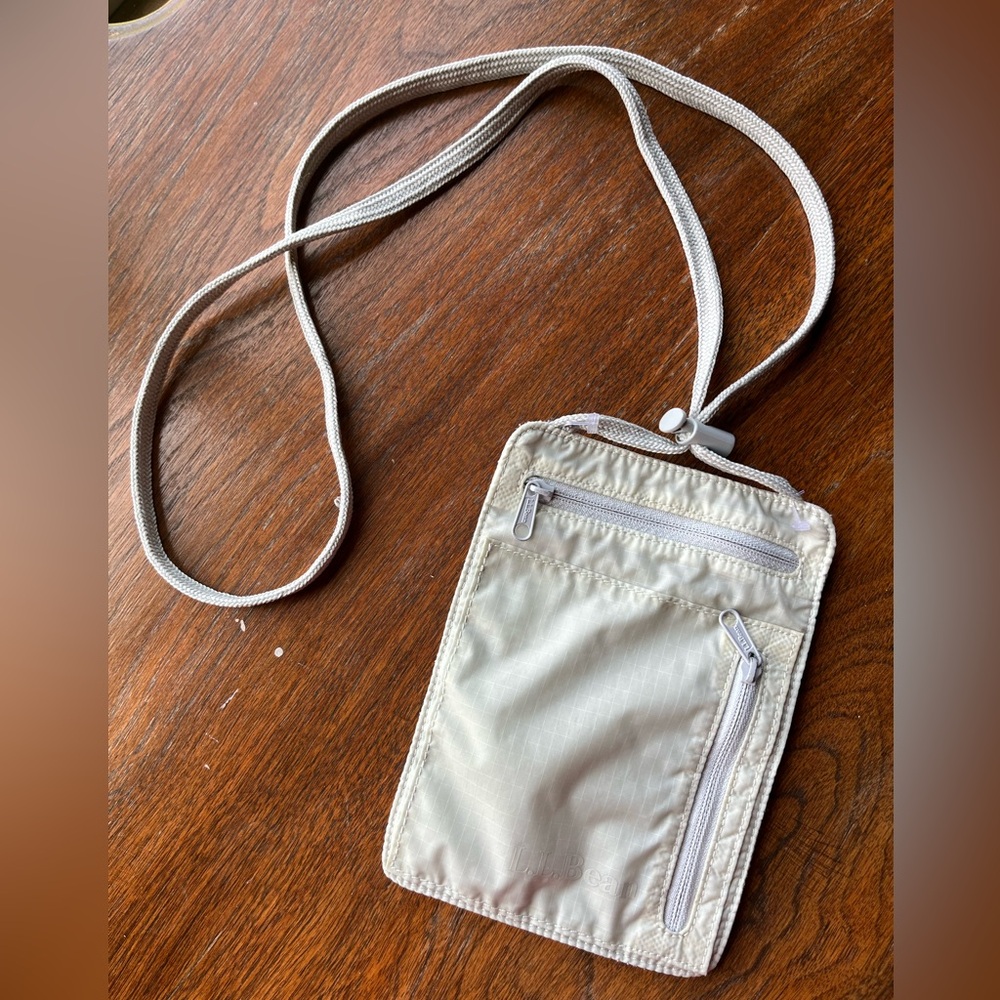 L. L. Bean neck style money, cards, ID,  safe for travel. Adjustable lanyard.